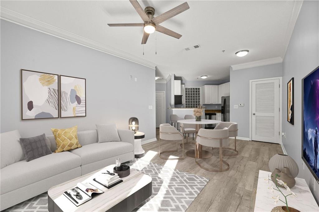10 Perimeter Summit Boulevard, Unit 3107 Atlanta, GA 30319 - Photo 2 of 44 a living room with furniture and a view of kitchen