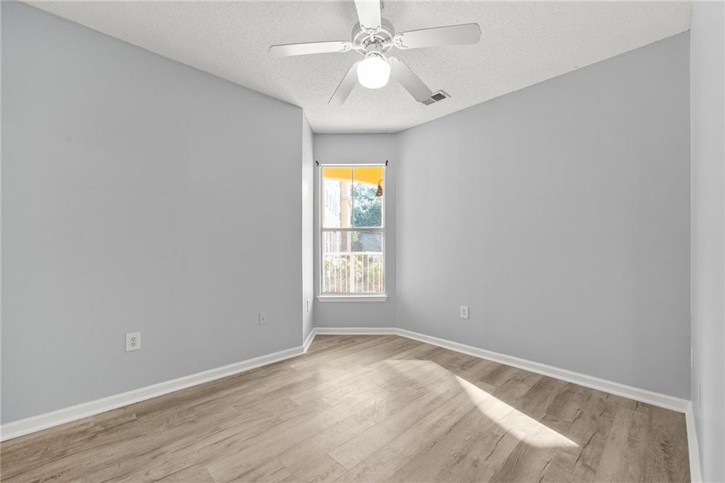 10 Perimeter Summit Boulevard, Unit 3107 Atlanta, GA 30319 - Photo 22 of 44 an empty room with a window and a fan