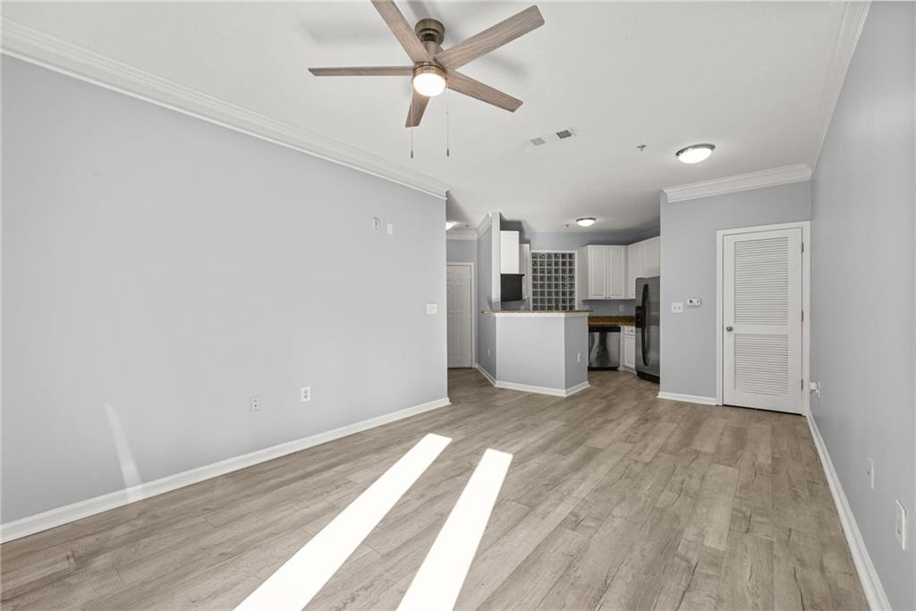 10 Perimeter Summit Boulevard, Unit 3107 Atlanta, GA 30319 - Photo 3 of 44 a view of a kitchen with a sink and a refrigerator