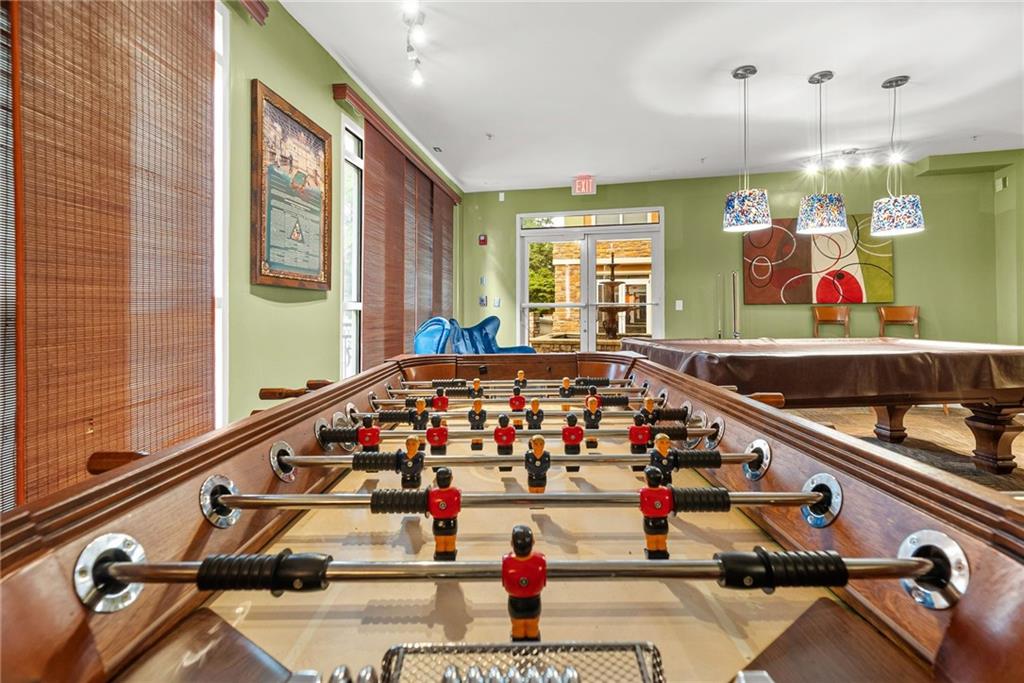 10 Perimeter Summit Boulevard, Unit 3107 Atlanta, GA 30319 - Photo 34 of 44 a room with lots of tables and window