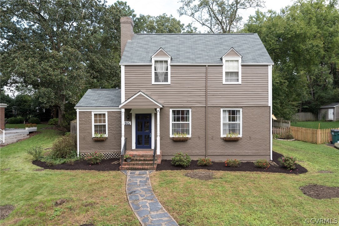 7618 Hollins Road Henrico, VA 23229 - Photo 1 of 15 a front view of a house with garden
