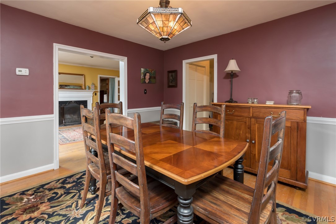 7618 Hollins Road Henrico, VA 23229 - Photo 10 of 15 a living room with furniture a dining table and a piano table