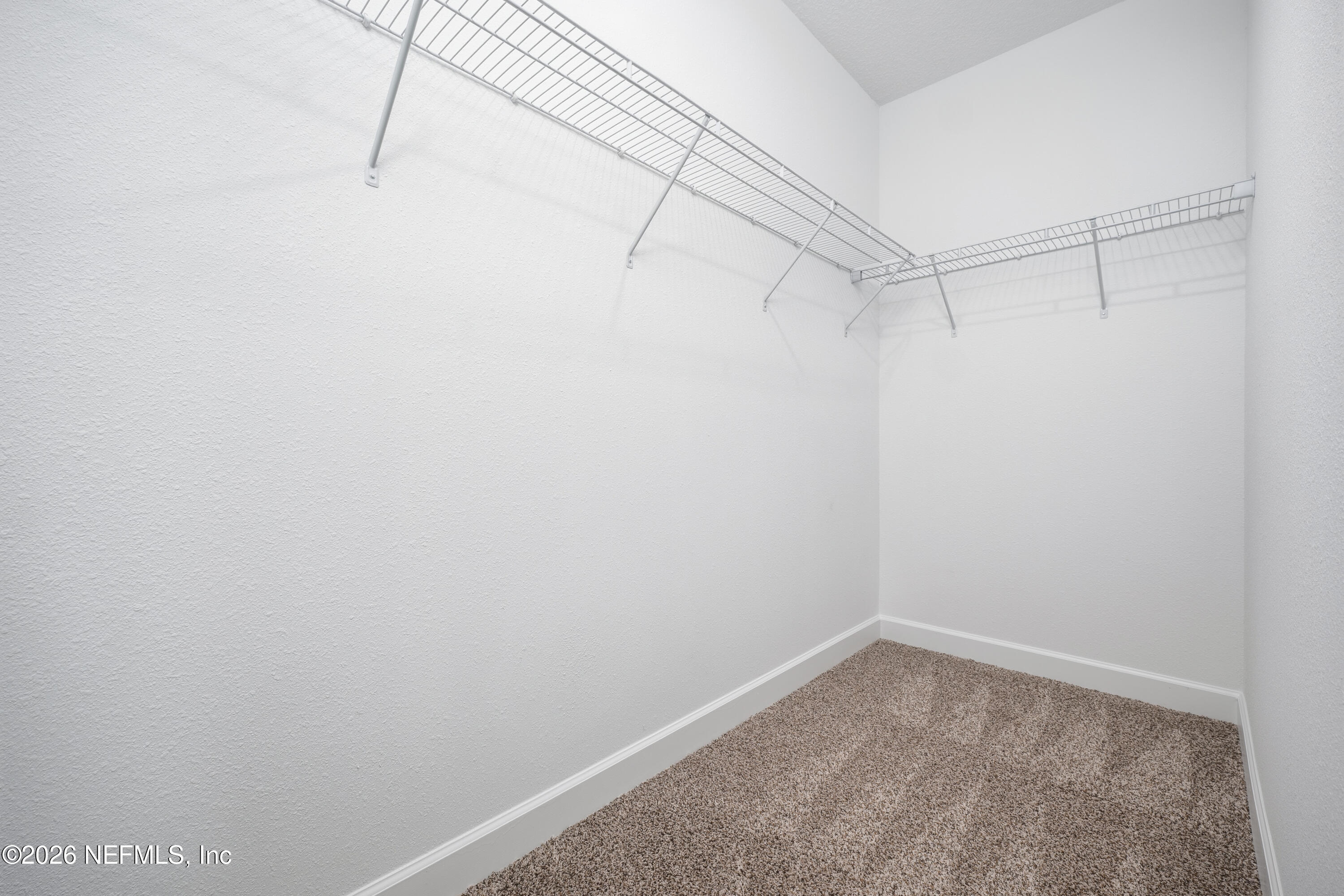 7596 Silver Sands Road Keystone Heights, FL 32656 - Photo 14 of 26 a view of a room with racks on the wall