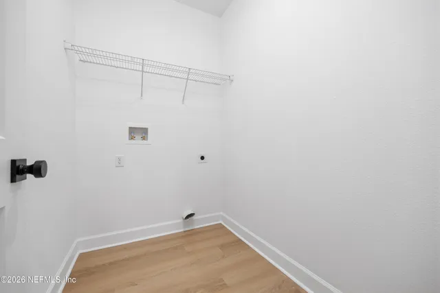 a view of an empty room with a white walls