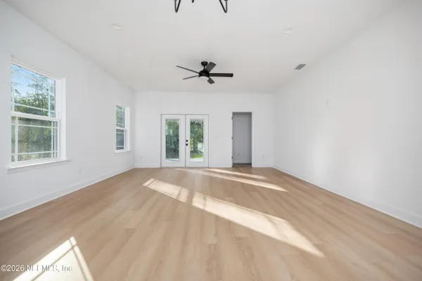 a view of an empty room with a window