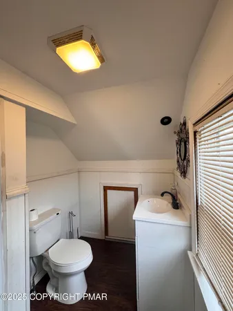 a bathroom with a toilet and a sink