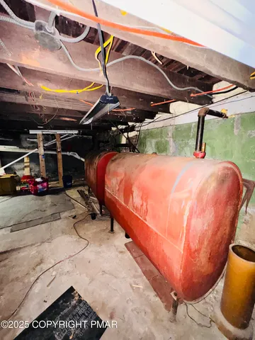 a blue and white umbrella sitting in a backyard