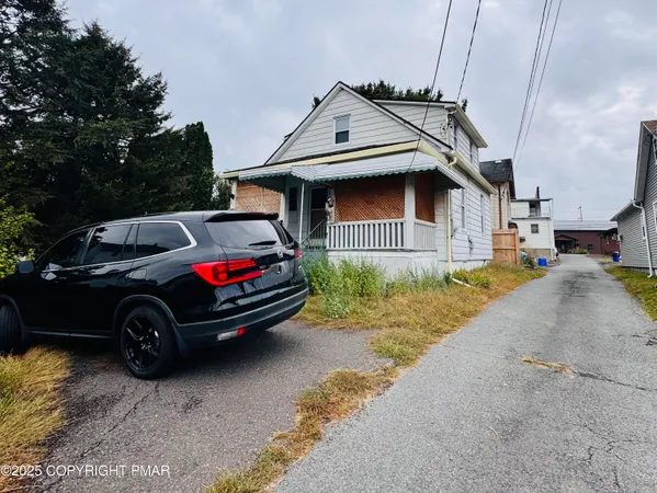 a car parked in front of a house