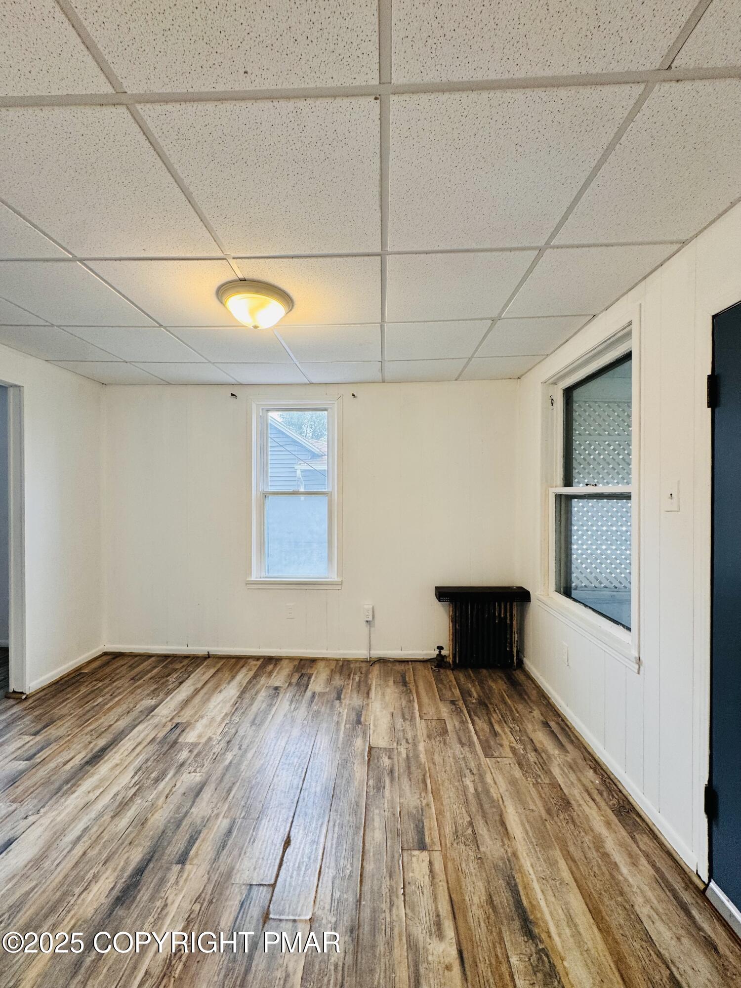 104 Serling Street Dupont, PA 18641 - Photo 3 of 18 a view of empty room with wooden floor