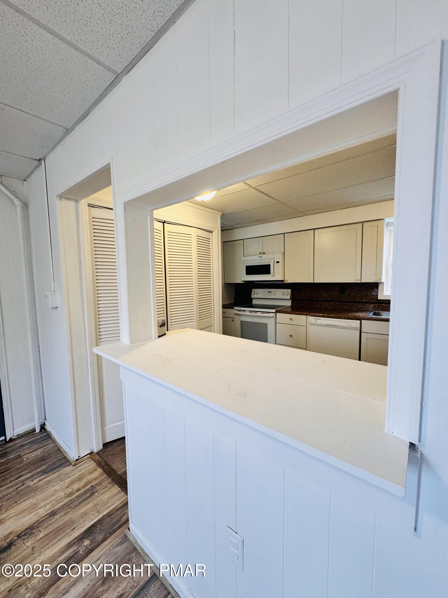 104 Serling Street Dupont, PA 18641 - Photo 5 of 18 a large white bed in a white room