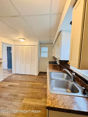 a view of a sink sitting in a kitchen