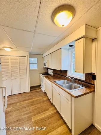 a kitchen with a sink and cabinets