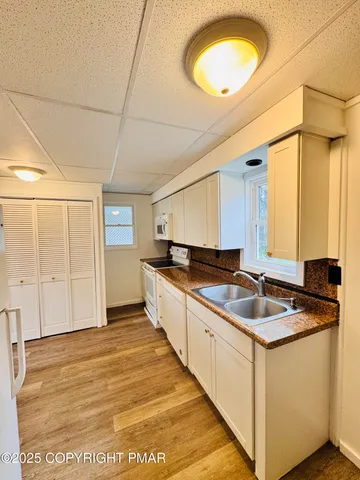 a kitchen with a sink and cabinets