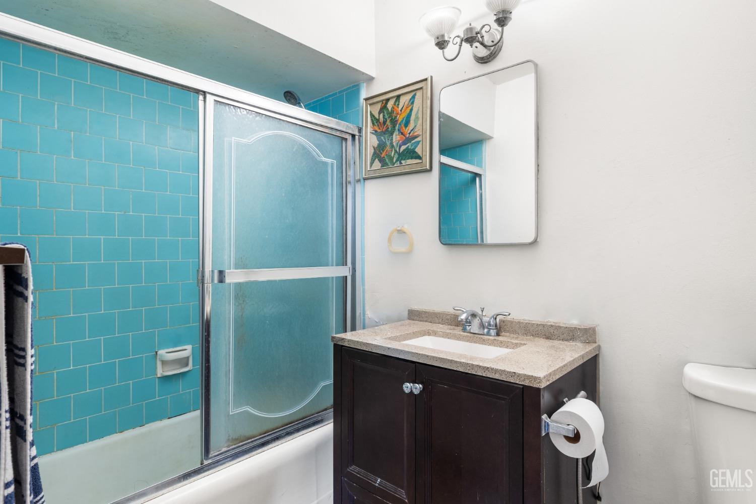 Undisclosed Address Taft, CA 93268 - Photo 12 of 14 a bathroom with a sink mirror and a shower