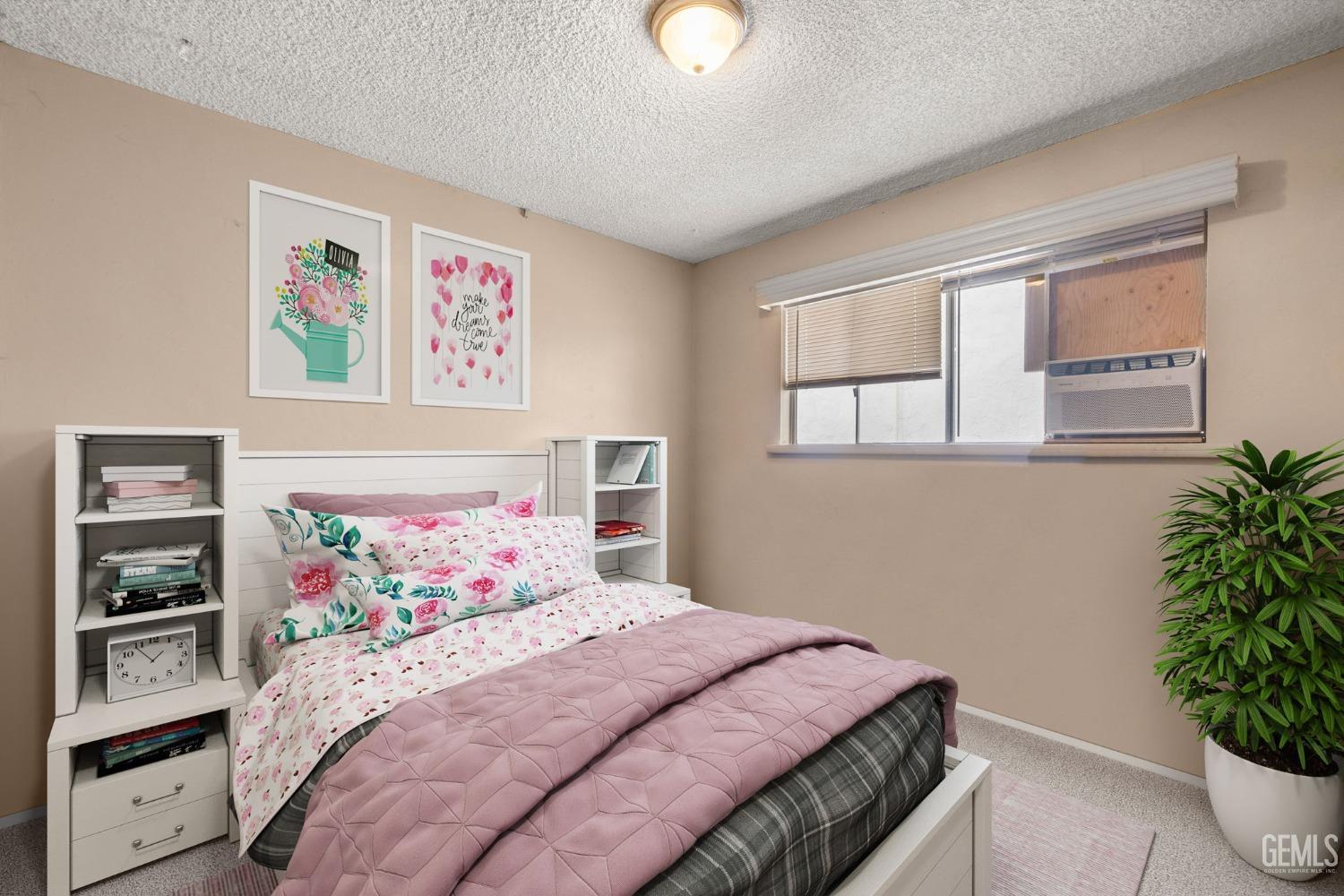 Undisclosed Address Taft, CA 93268 - Photo 13 of 14 a bedroom with a bed and a potted plant