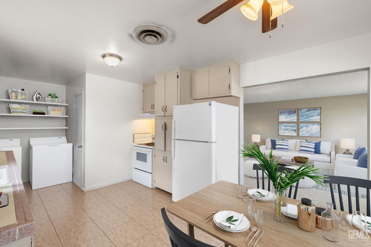 Undisclosed Address Taft, CA 93268 - Photo 6 of 14 a kitchen with furniture and a refrigerator