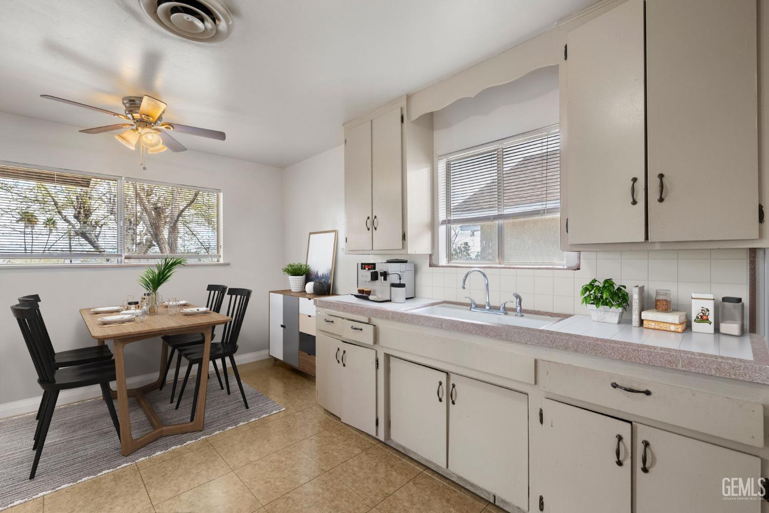 Undisclosed Address Taft, CA 93268 - Photo 7 of 14 a kitchen with a table chairs sink and cabinets
