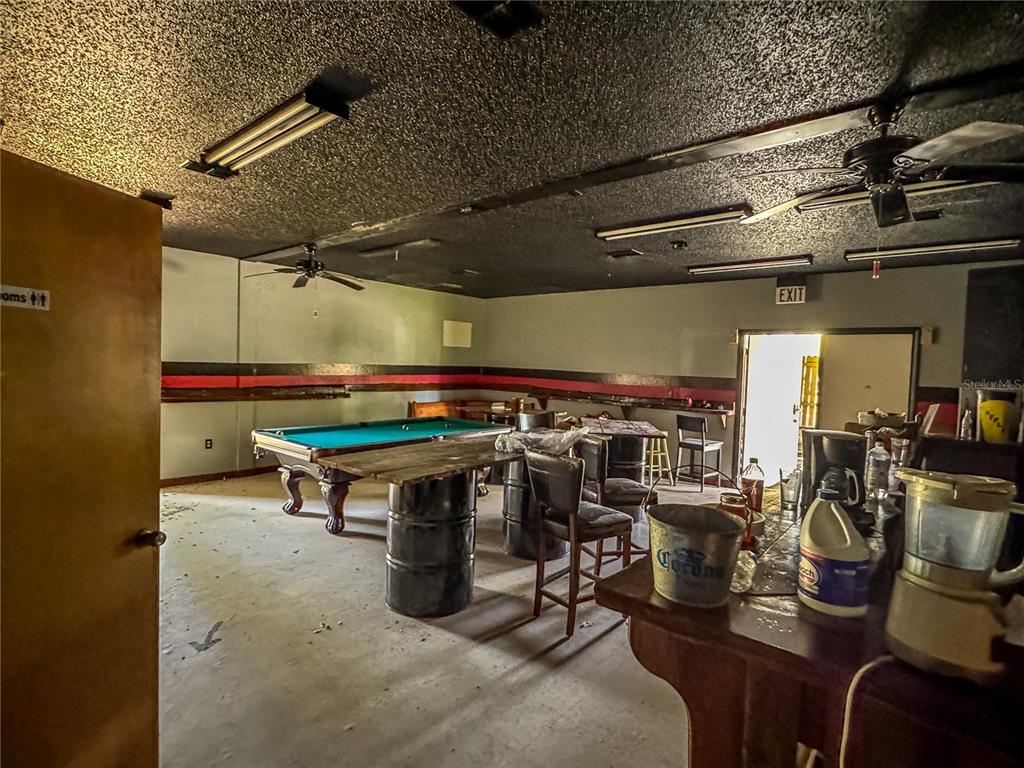 615 Hospital Road Brooksville, FL 34601 - Photo 12 of 75 a room with lots of tables and chairs