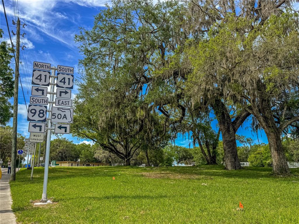 615 Hospital Road Brooksville, FL 34601 - Photo 3 of 75 a view of a building with a yard
