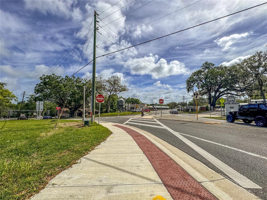 615 Hospital Road Brooksville, FL 34601 - Photo 34 of 75 a view of a city street lined with buildings and trees