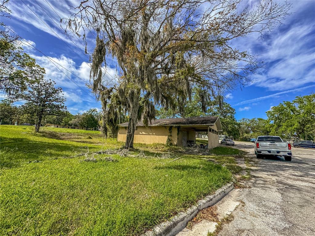 615 Hospital Road Brooksville, FL 34601 - Photo 58 of 75 a view of a house with a back yard