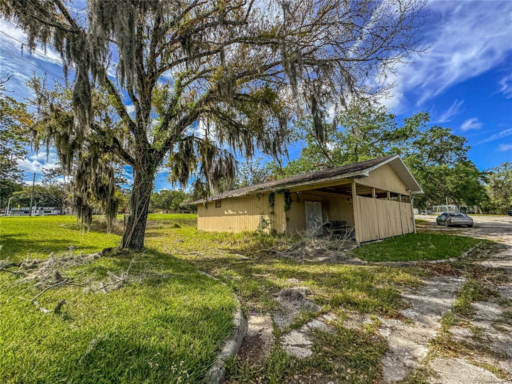 615 Hospital Road Brooksville, FL 34601 - Photo 59 of 75 a view of a house with a yard