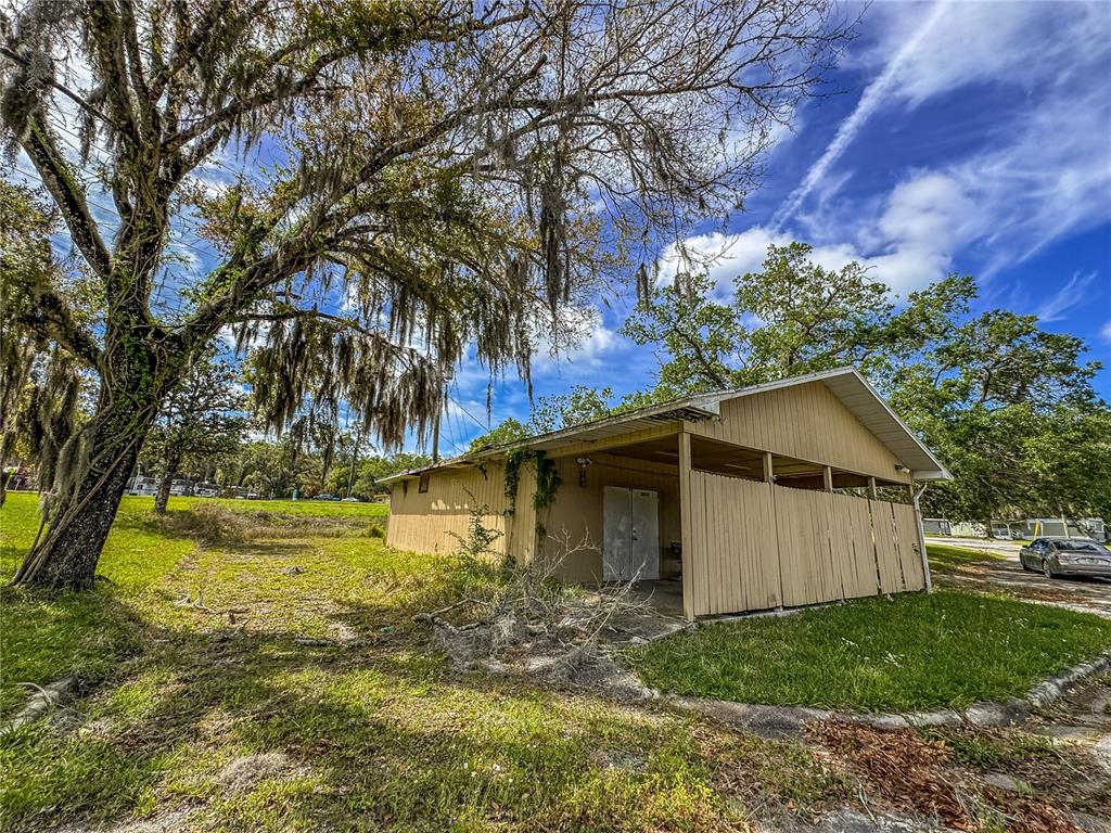 615 Hospital Road Brooksville, FL 34601 - Photo 60 of 75 a view of a yard with plants and large trees