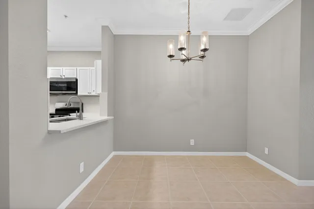 an empty room with a empty space and windows