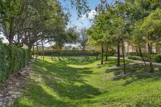 a view of swimming pool with outdoor seating and city view
