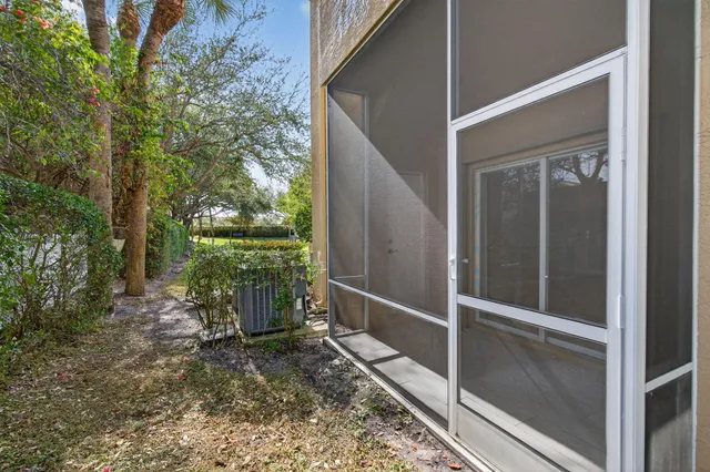 a view of a patio with swimming pool table and chairs