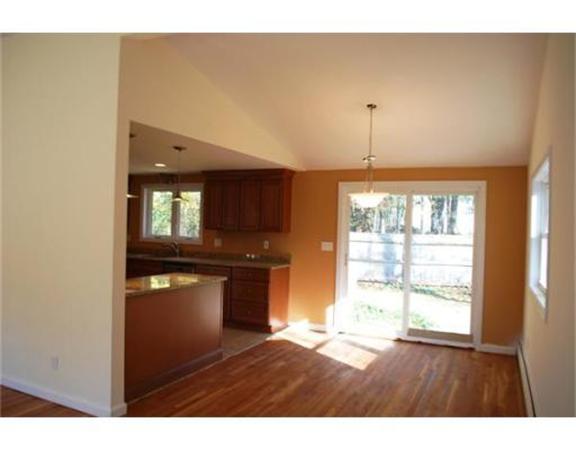 3 Peterson Road Natick, MA 01760 - Photo 3 of 19 a view of an empty room with a window and wooden floor