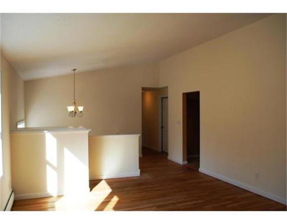 3 Peterson Road Natick, MA 01760 - Photo 5 of 19 a view of an empty room with wooden floor