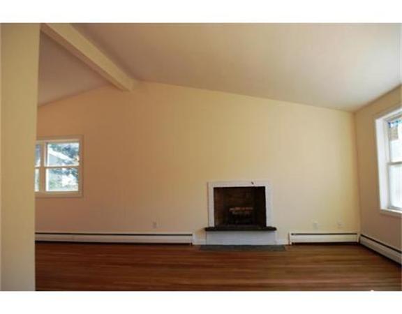 3 Peterson Road Natick, MA 01760 - Photo 7 of 19 a view of an empty room with wooden floor and a window