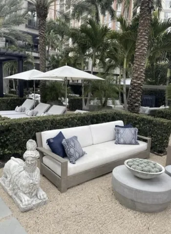 a view of a house with couches and a fire pit