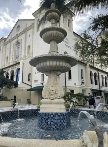 a view of a chairs and table in backyard