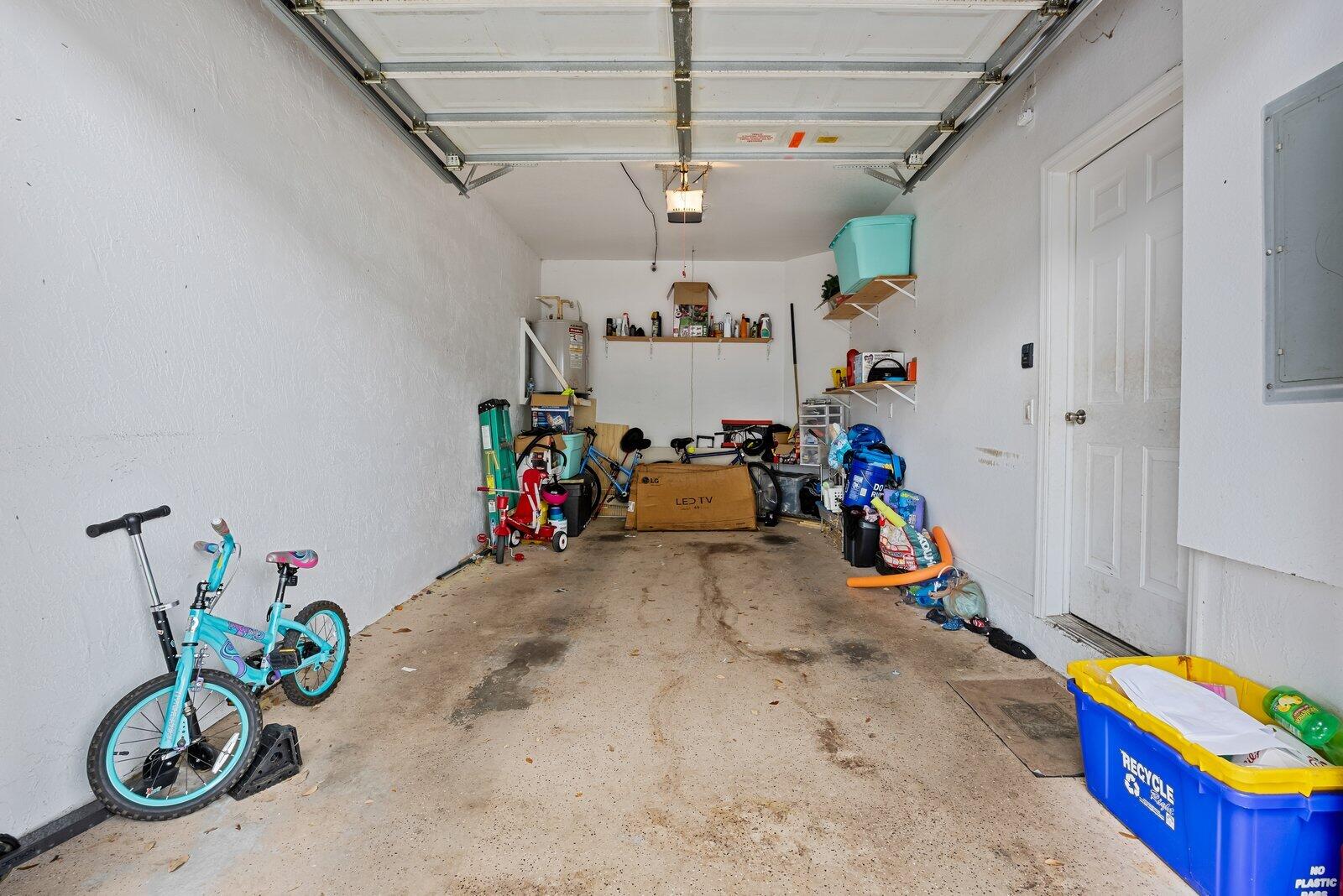 1955 Alamanda Way Riviera Beach, FL 33404 - Photo 19 of 25 a view of play room with toys and a chandelier