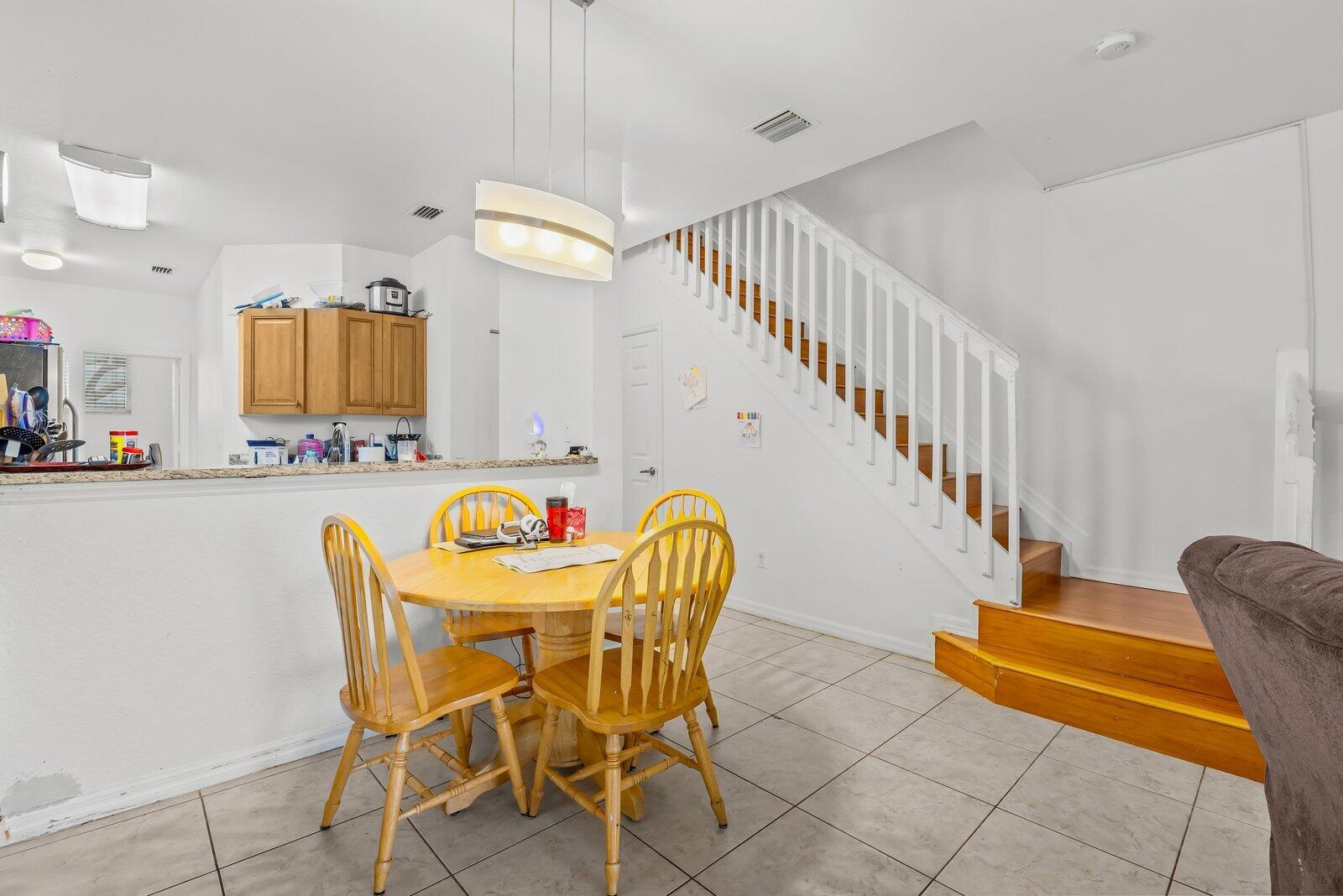 1955 Alamanda Way Riviera Beach, FL 33404 - Photo 4 of 25 a dining room with furniture and wooden floor