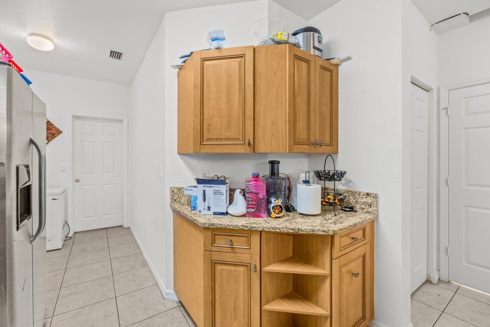 1955 Alamanda Way Riviera Beach, FL 33404 - Photo 7 of 25 a bathroom with a sink a washer and dryer