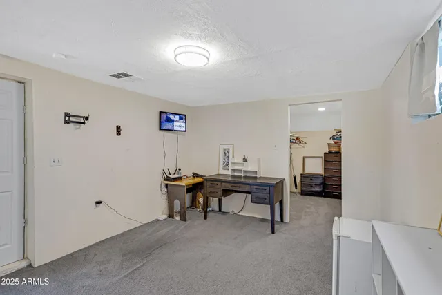 a view of a workspace with furniture