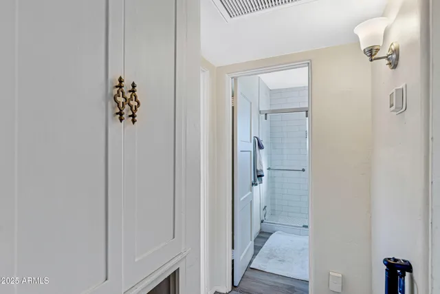 a view of a bathroom from the hallway