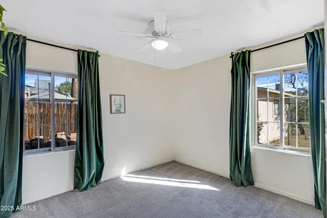 a bathroom with a sink vanity granite tub shower and a mirror