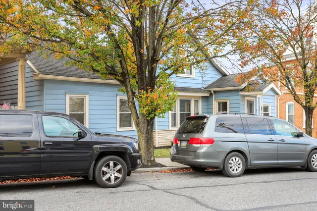 a car parked in front of a house