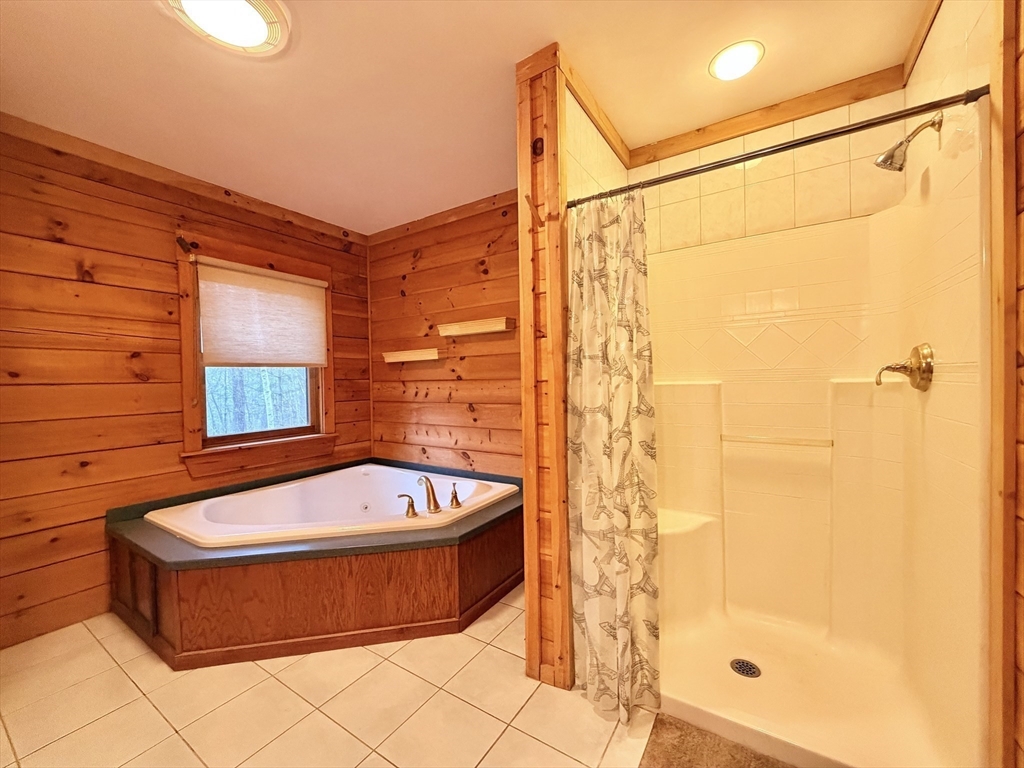 1854 Greenwich Road Hardwick, MA 01082 - Photo 29 of 42 a bathroom with a tub a shower and a sink