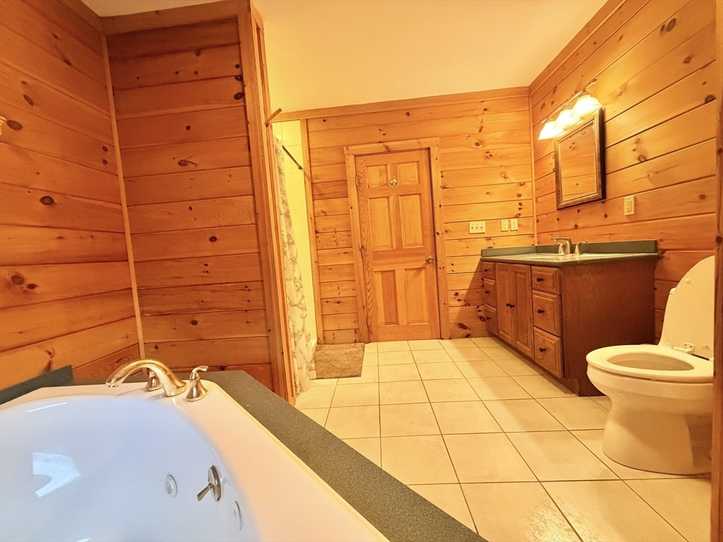 1854 Greenwich Road Hardwick, MA 01082 - Photo 31 of 42 a bathroom with a granite countertop sink toilet and shower