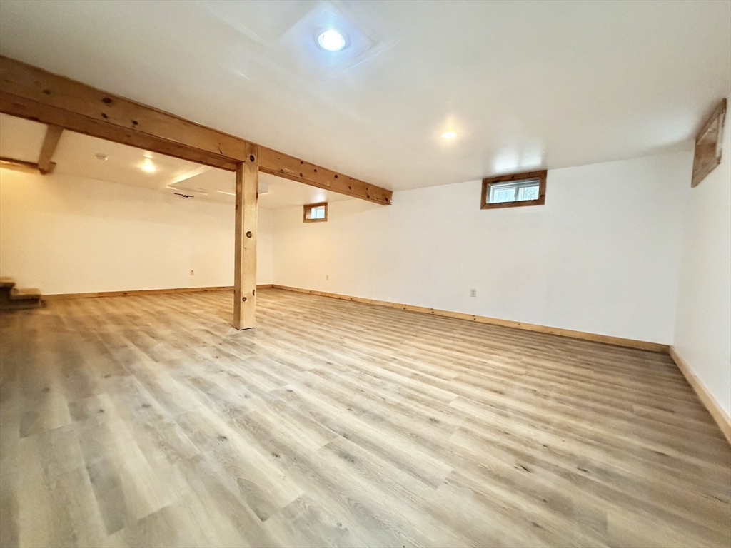 1854 Greenwich Road Hardwick, MA 01082 - Photo 36 of 42 an empty room with wooden floor and windows