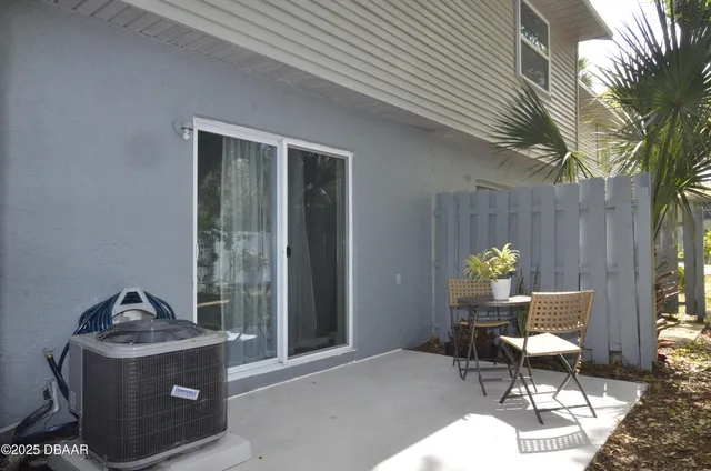 a view of a patio in back of house