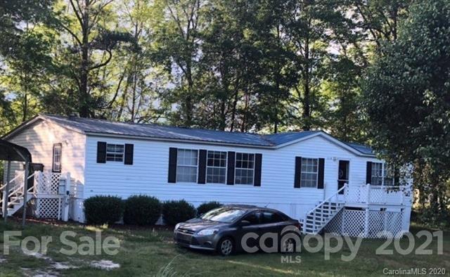 2196 Rocky River Road Lancaster, SC 29720 - Photo 1 of 1 a front view of a house with parking space