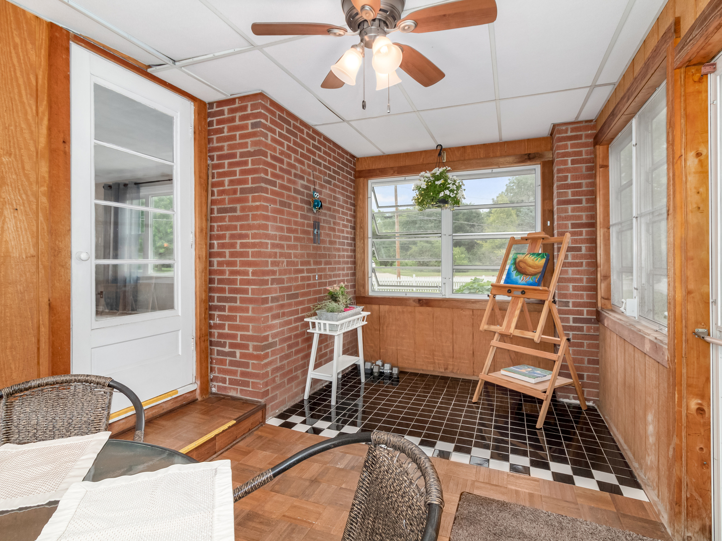 810 North Gary Avenue Wheaton, IL 60187 - Photo 12 of 36 a dining room with wooden floor and a floor to ceiling window