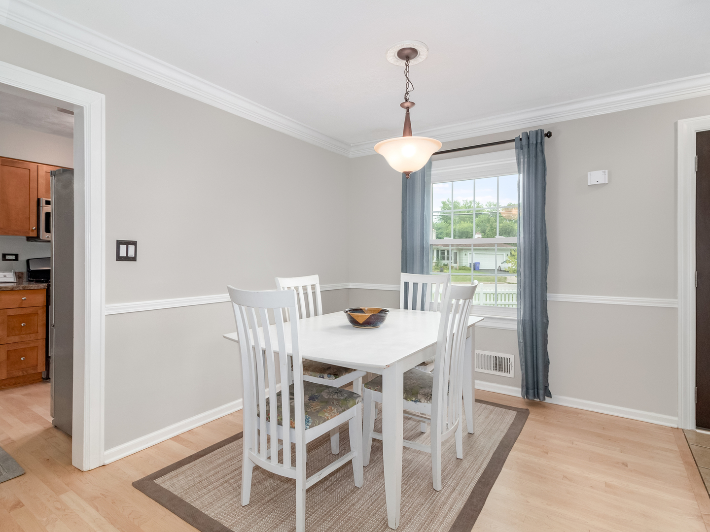 810 North Gary Avenue Wheaton, IL 60187 - Photo 13 of 36 a view of a dining room with furniture wooden floor and chandelier