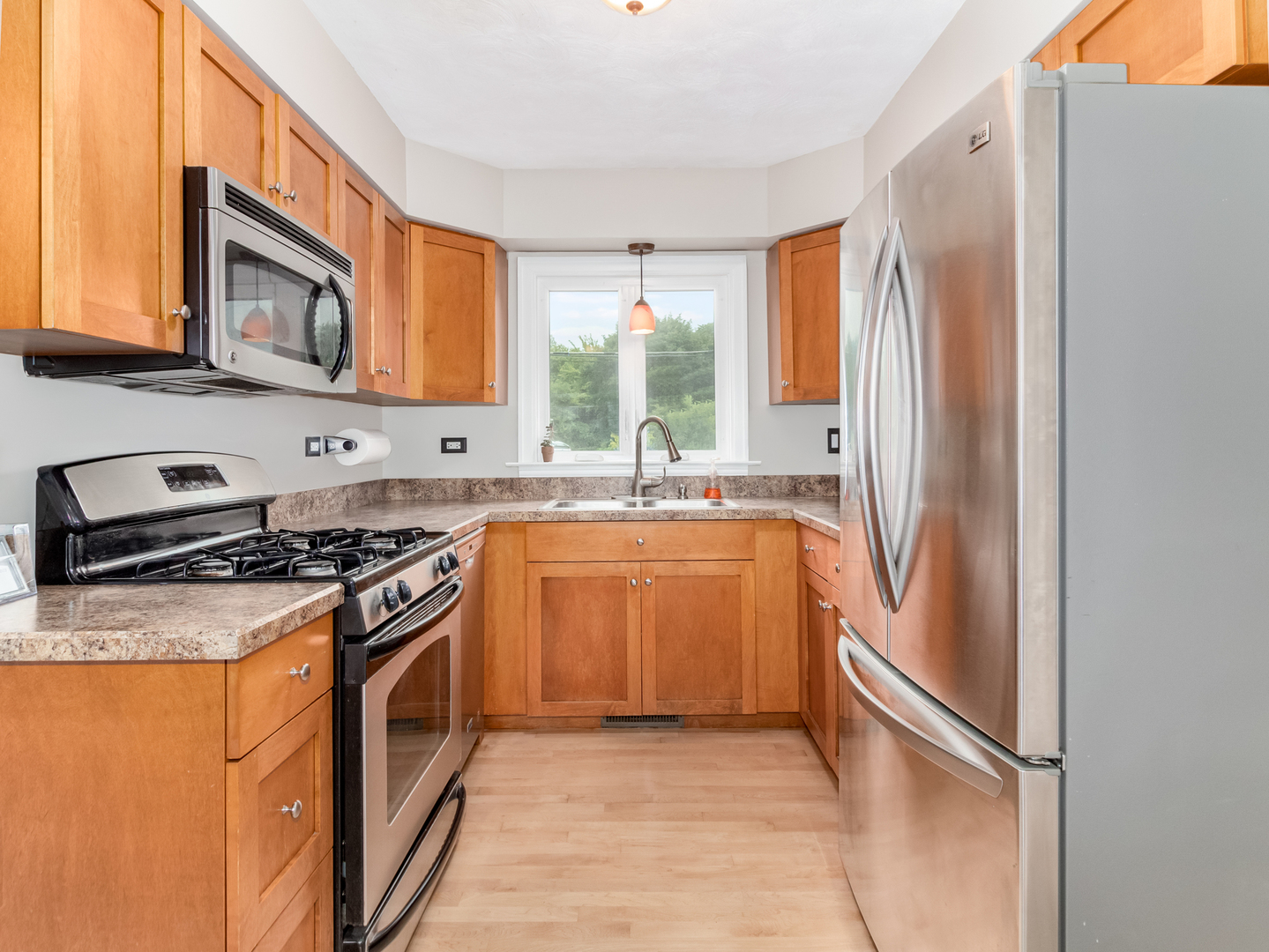 810 North Gary Avenue Wheaton, IL 60187 - Photo 15 of 36 a kitchen with stainless steel appliances granite countertop a stove a sink and a refrigerator